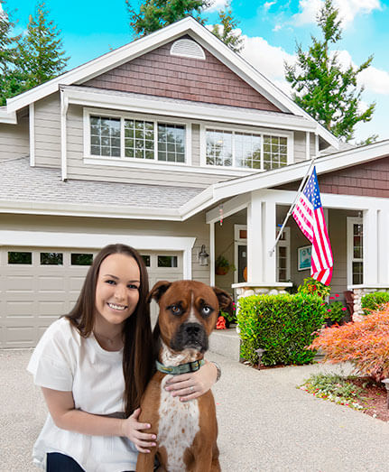 Sydney Peck and her dog, Damon, in front of a house with an American Flag.